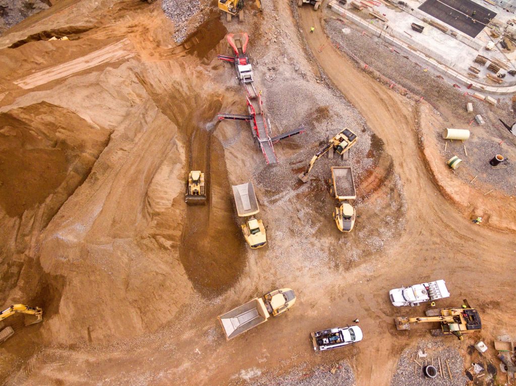 trucks and diggers in a mining site